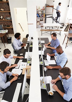 SwiftMaze team discussion in office workspace